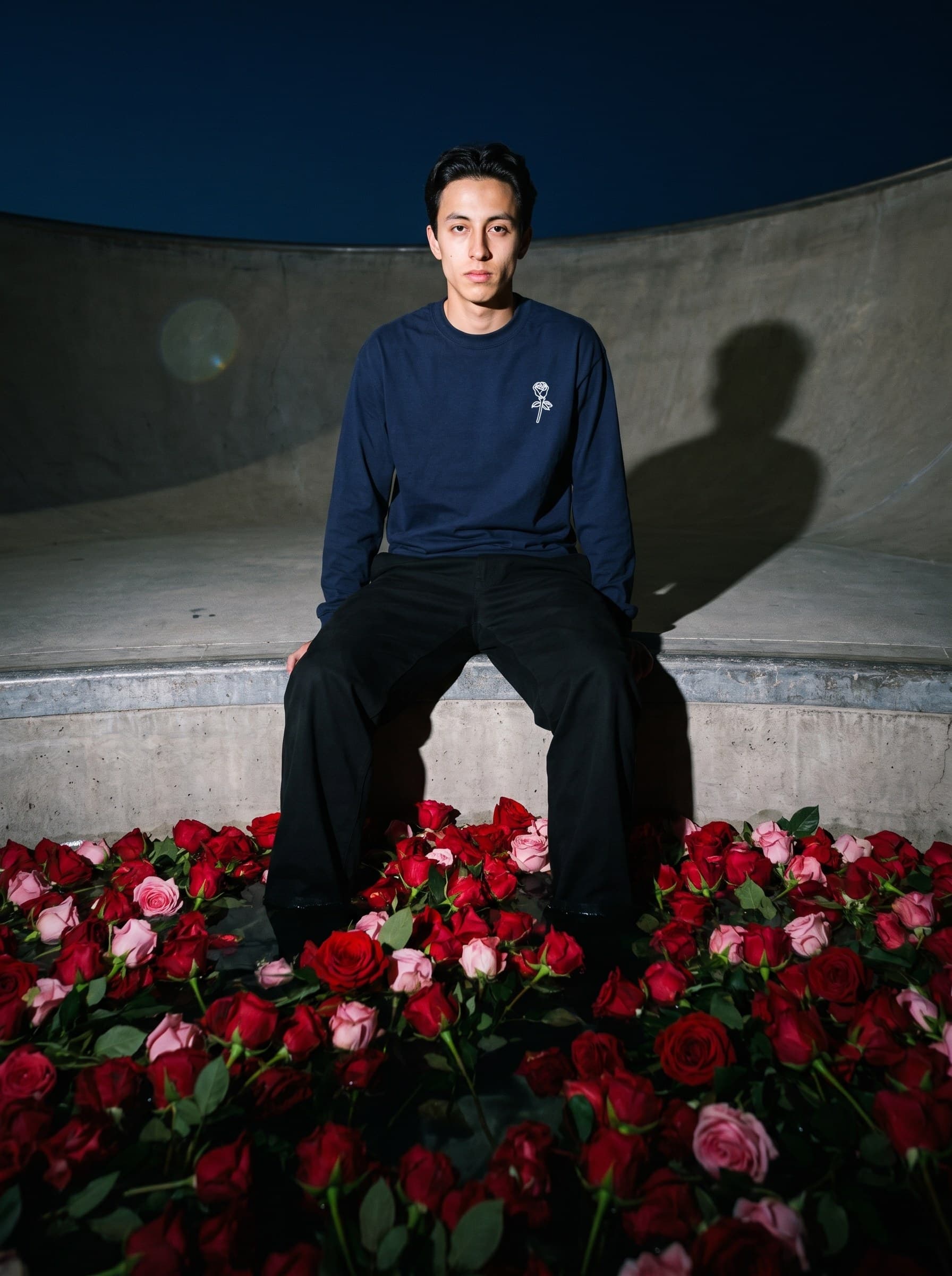 On the coping at night, Big Rose longsleeve, flash-lit