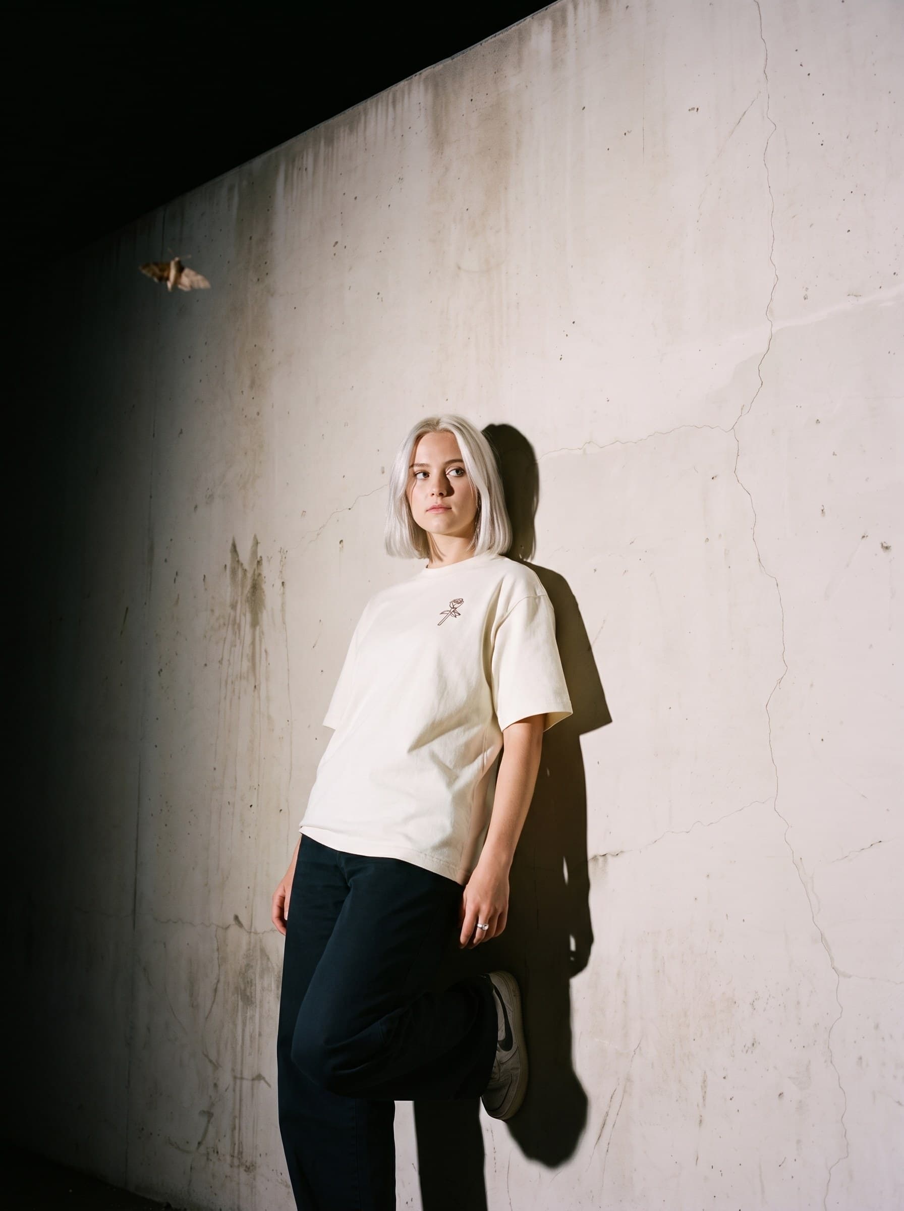 Against the wall at night, Big Rose tee