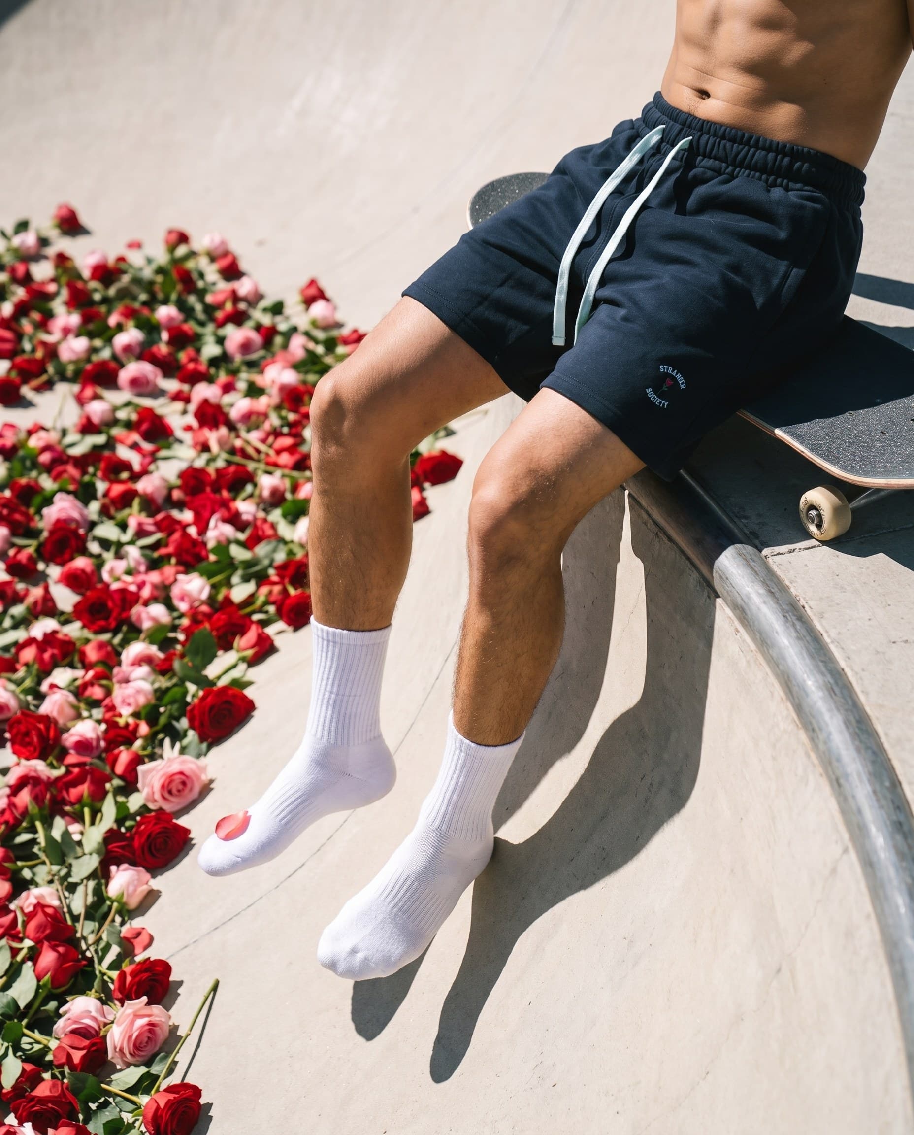 Legs over the rose-filled bowl
